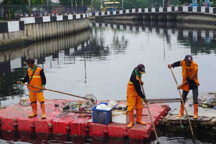 ASIAD 2018: Indonesia phủ nylon kín sông ô nhiễm để khỏi bẩn mắt làng VĐV - Ảnh 4.
