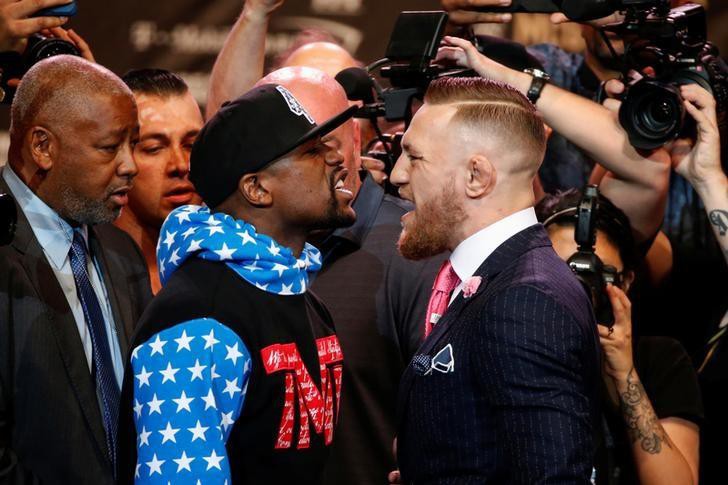 Các nhà tổ chức kiếm bộn tiền từ 4 buổi họp báo quảng bá cho trận Mayweather - McGregor. Ảnh: Reuters.