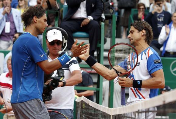 Ferrer of Spain shakes hands with his compatriot Nadal after winning their quarter-final match at the Monte Carlo Masters in Monaco
