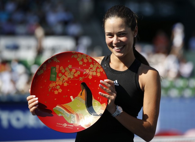 Ivanovic of Serbia poses with her trophy after defeating Wozniacki of Denmark at their Pan Pacific Open women's singles final tennis match in Tokyo
