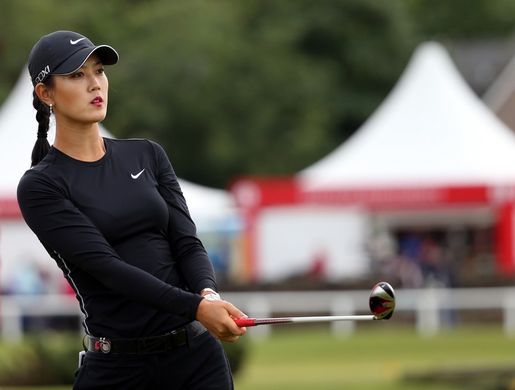 Michelle Wie of the USA, tees off the second hole during the first round of the Women's British Open golf championship on the Old Course at St Andrews, Scotland, Thursday Aug. 1, 2013. (AP Photo/Scott Heppell)