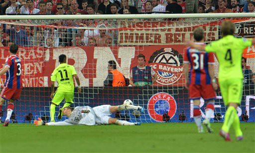 Barcelona's Neymar scores his side's first goal during the soccer Champions League second leg semifinal match between Bayern Munich and FC Barcelona at Allianz Arena in Munich, southern Germany, Tuesday, May 12, 2015. (AP Photo/Kerstin Joensson)