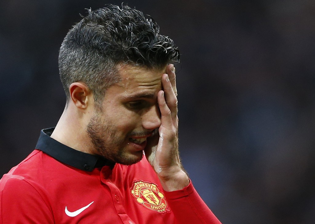 Manchester United's Robin van Persie reacts after losing to Newcastle United in their English Premier League soccer match at Old Trafford in Manchester, northern England, December 7, 2013.   REUTERS/Darren Staples   (BRITAIN - Tags: SPORT SOCCER) FOR EDITORIAL USE ONLY. NOT FOR SALE FOR MARKETING OR ADVERTISING CAMPAIGNS. NO USE WITH UNAUTHORIZED AUDIO, VIDEO, DATA, FIXTURE LISTS, CLUB/LEAGUE LOGOS OR "LIVE" SERVICES. ONLINE IN-MATCH USE LIMITED TO 45 IMAGES, NO VIDEO EMULATION. NO USE IN BETTING, GAMES OR SINGLE CLUB/LEAGUE/PLAYER PUBLICATIONS