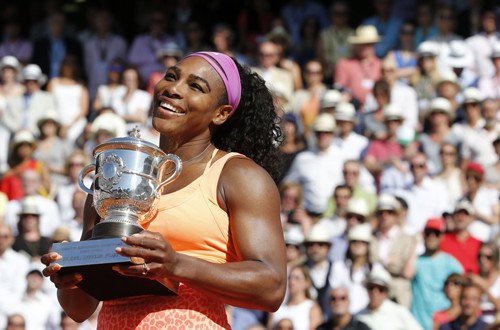 Serena Williams of the US poses with the trophy during the ceremony after defeating Lucie Safarova of the Czech Republic during their women's singles final match to win the French Open tennis tournament in Paris