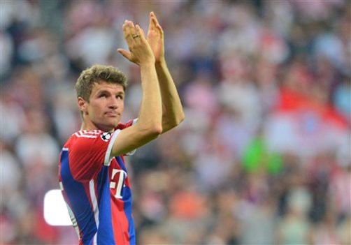 Bayern Munich's Thomas Mueller claps his hands after the Champions League semi final soccer match FC Bayern Munich vs FC Barcelona in Munich, Germany, 12 May 2015. Photo by: Peter Kneffel/picture-alliance/dpa/AP Images
