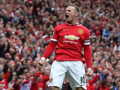 MANCHESTER, ENGLAND - AUGUST 16:  Wayne Rooney of Manchester United celebrates scoring their first goal during the Barclays Premier League match between Manchester United and Swansea City at Old Trafford on August 16, 2014 in Manchester, England.  (Photo by Matthew Peters/Man Utd via Getty Images)